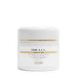 White jar of Crème M.E.C. with gold accents on a white background