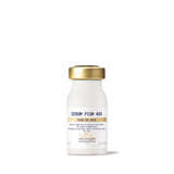 A white bottle with a gold cap labeled 'SERUM PIGM 400' from Biologique Recherche.